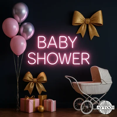 تابلو نئون جشن نوزاد با متن BABY SHOWER در رنگ صورتی و آبی کنار دکور جشن